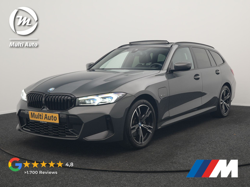 BMW 3-serie Touring 330e M Sport FACELIFT PHEV 293pk Dealer O.H. | Dravitgray | Trekhaak Af Fabriek | Panodak | Head Up | Camera | Lederen Sportstoelen Verwarmd | Sfeerverlichting | Apple Carplay | Keyless | Blis | Cruise Control | Navigatie | DAB | Plug In Hybrid |