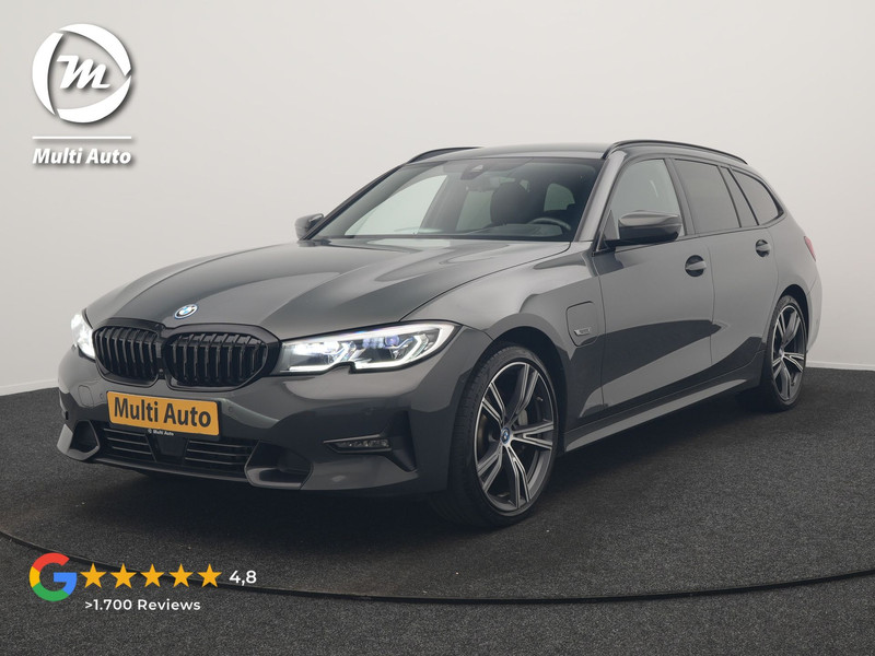 BMW 3-serie Touring 330e Sportline PHEV 293pk Dealer O.H. | Dravitgrau | Trekhaak Af Fabriek | Adaptive Cruise | Laser LED | Head Up | Adaptief Onderstel | Camera | Sportstoelen Verwarmd | Sfeerverlichting | Keyless | Blis | Apple Carplay | 19"L.M | Plug In Hybrid |