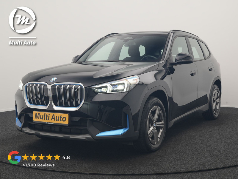BMW iX1 xDrive30 67 kWh 313pk Dealer O.H. | Trekhaak Af Fabriek | Camera | Adaptief M Onderstel | Voorstoelen Verwarmd | Blis | Keyless | Apple Carplay | Adaptive LED | Sfeerverlichting | Widescreen Navi | DAB |