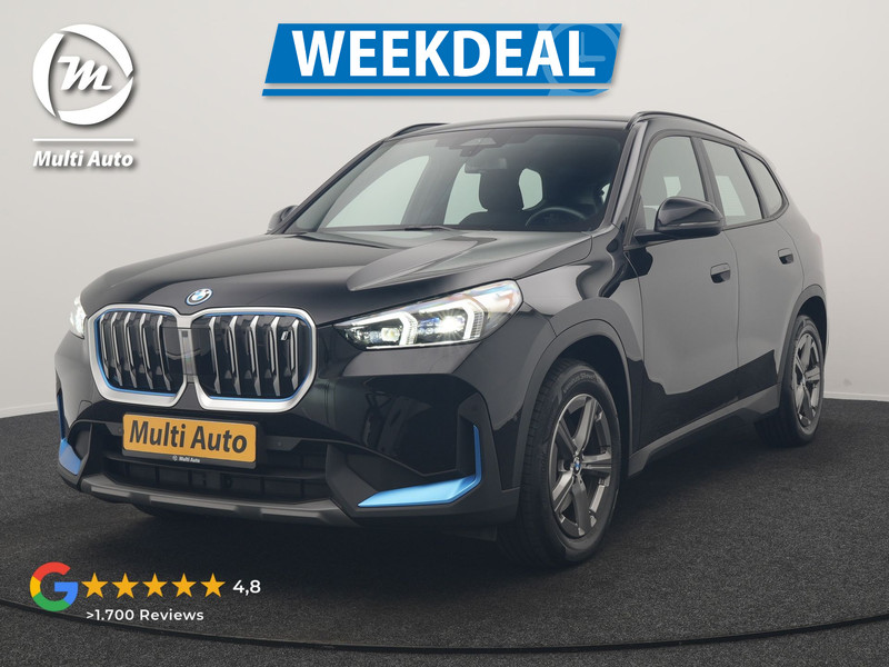 BMW iX1 xDrive30 67 kWh 313pk Dealer O.H. | Trekhaak Af Fabriek | Camera | Adaptief M Onderstel | Voorstoelen Verwarmd | Blis | Keyless | Apple Carplay | Adaptive LED | Sfeerverlichting | Widescreen Navi | DAB |